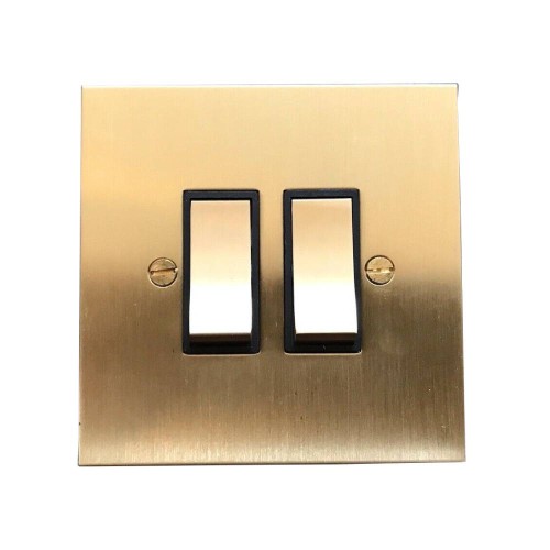 2 Gang 2 Way 20AX Rocker Switch in Brushed Brass Plate and Rocker and Black Trim by Forbes and Lomax