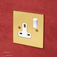1 Gang 13A Switched Single Socket in Unlacquered Brass Plate with Plastic Rocker and Trim