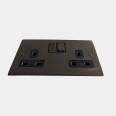 2 Gang 13A Switched Double Socket in Polished Bronze and Black Insert Stylist Grid Flat Plate