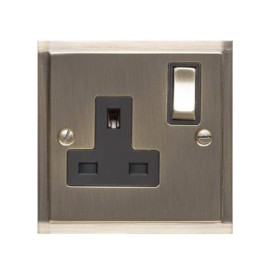 1 Gang 13A Switched Single Socket in Antique Brass and Black Trim Elite Stepped Flat Plate