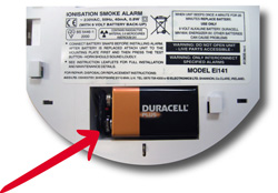 With the alarm removed, you will be able to see the battery in the back. Remove the old battery from the snap connectors and replace with a new one, then refit the alarm.