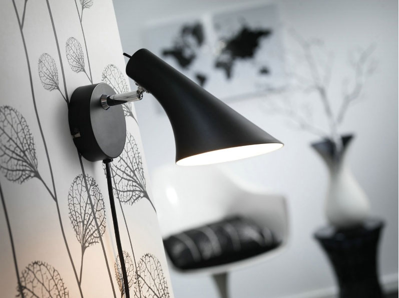 Single spotlight for wall mounting, in a black finish and a conical shade, the NX302 Vanila Wall Lamp is ideal for the modern home. Single Spot on a round base - everything in a modern black finish - the Nordlux Vanila Black Wall Spotlight has a switch mounted on the lamp and also has a cord(which can be removed). This Nordlux Vanilla 72711003 black wall spotlight takes 1 x 40W E14, has a max. 26cm projection, is IP20 rated, comes with a black cord 2.1m long, and is of metal construction. Buy online the Nordlux Vanila NX302 Black Wall Lamp - single wall mounted spotlight in a stylish black finish.