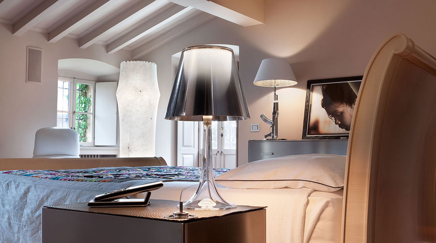 Philippe Starck and his illustrious history with Flos lighting - his classic Miss K Lamp