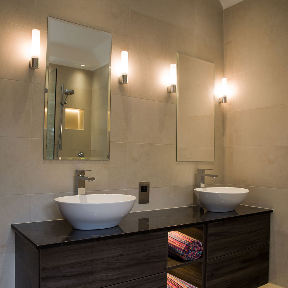 An Ideal set-up for Bathroom Lighting, from Task Lighting to Magnifying Mirrors - see the Bari wall mounted light beside the mirror